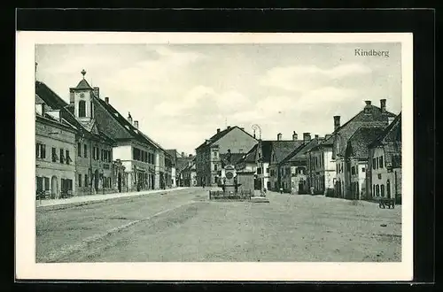 AK Kindberg, Strassenpartie mit Geschäften und Denkmal