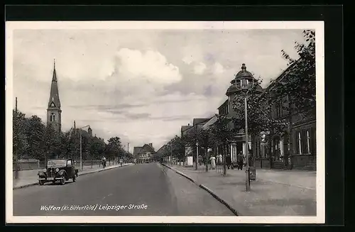 AK Wolfen /Kr. Bitterfeld, Leipziger Strasse mit Geschäft