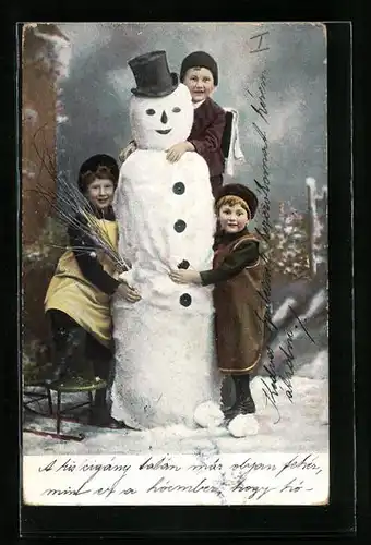 AK Kinder bauen einen Schneemann