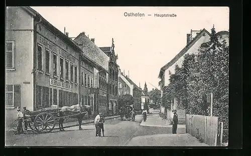 AK Osthofen, Hauptstrasse mit Bahn-Hotel und Pferdewagen