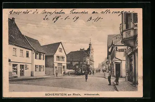 AK Schierstein am Rhein, Wilhelmstrasse mit Geschäften und Strassenbahn