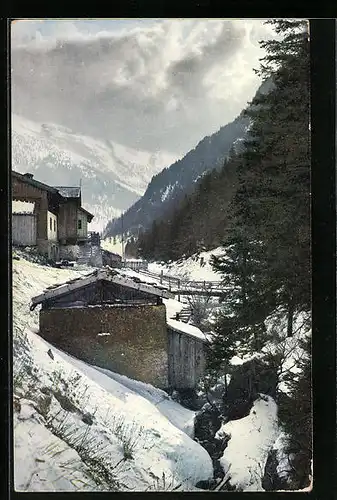 Künstler-AK Photochromie Nr. 1801: Verschneite Ortschaft in den Bergen, Ortspartie