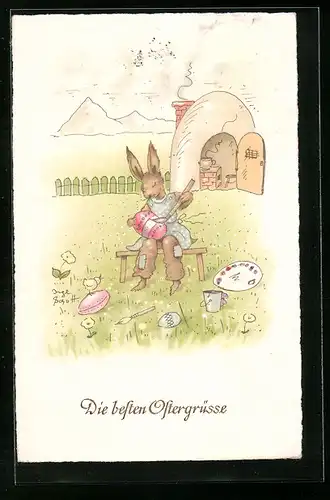 AK Osterhase bemalt ein Osterei