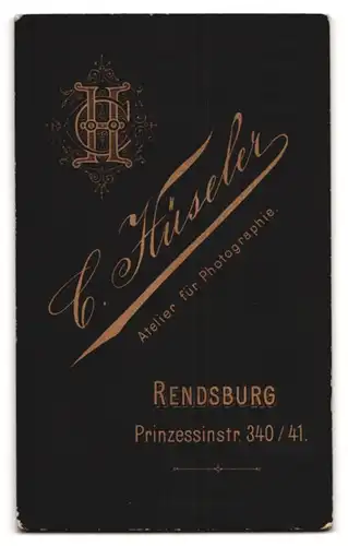 Fotografie C. Hüseler, Rendsburg, Prinzessinstr. 340-341, Knabe auf Schaukelpferd sitzend