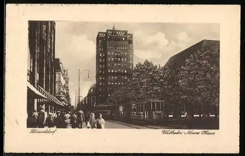 AK Düsseldorf, Wilhelm Marx Haus mit Strassenbahnen