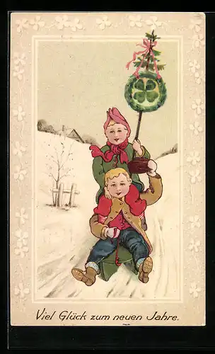 Präge-AK Zwei Kinder auf einem Schlitten, Neujahrsgruss