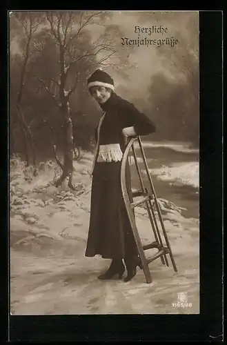 AK Junge Frau mit einem Schlitten, Neujahrsgruss