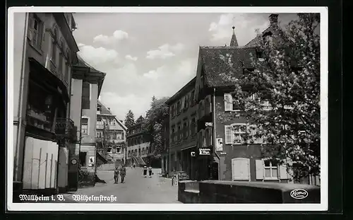 AK Müllheim i. B., Wilhelmstrasse mit Geschäft