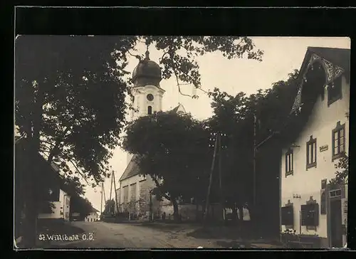 AK St. Willibad, Strassenpartie mit Kirche und Postamt
