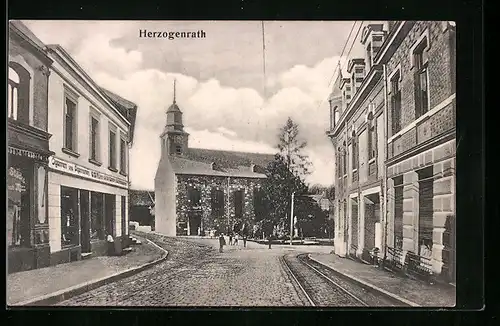 AK Herzogenrath, Strassenpartie mit Kirche