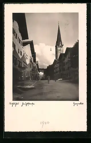 AK Kitzbühel, Hauptstrasse mit Kirchturm