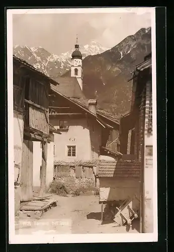 AK Tarrenz, Strassenpartie mit Kirche