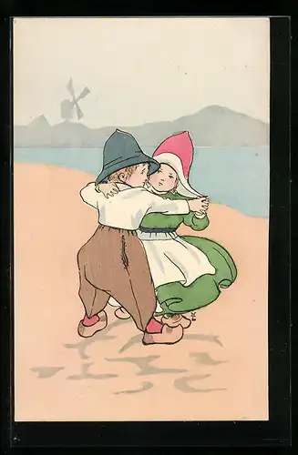 AK Kleines Paar in niederländischer Tracht beim Tanzen am Strand