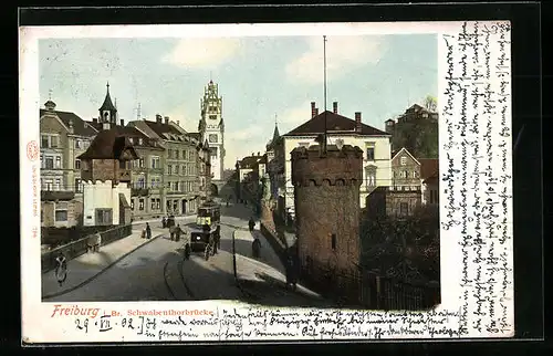 AK Freiburg i. Br., Schwabenthorbrücke mit Strassenbahn und Kutsche