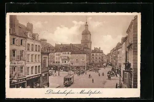 AK Diedenhofen, Marktplatz mit Geschäften und Strassenbahn