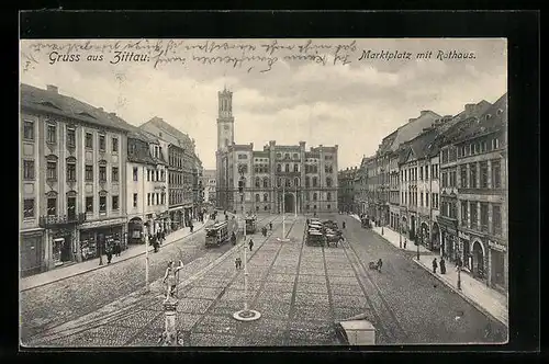 AK Zittau, Strassenpartie mit Geschäften und Strassenbahn