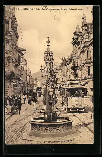 AK Freiburg i. Br., Der Fischbrunnen in der Kaiserstrasse mit Strassenbahn