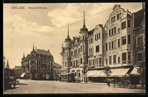 AK Ohligs, Bahnhof-Strasse mit Geschäften und Strassenbahn