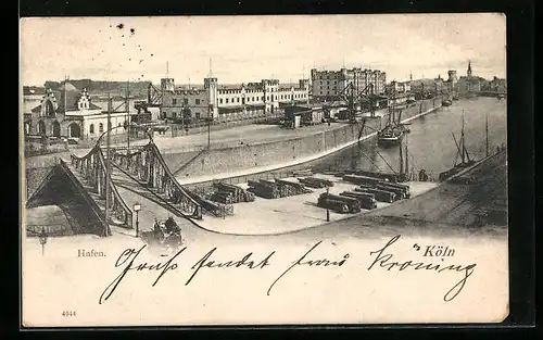 AK Köln, Hafen mit Brücke und Holzlager