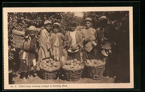 AK Native boys carrying oranges to Packing Shed