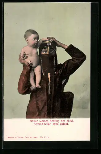 AK Native woman bearing her child