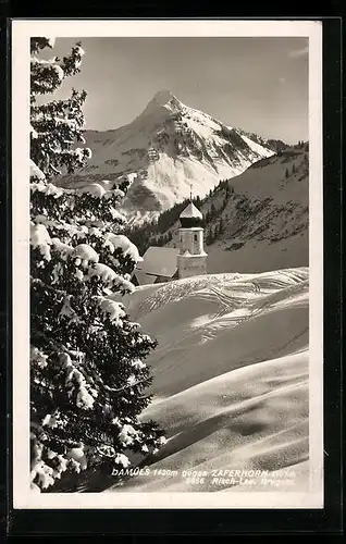 AK Damüls, Ortspartie mit Kirche und Zaferhorn im Winter