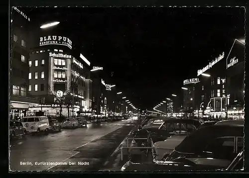 AK Berlin, Kurfürstendamm mit Geschäften bei Nacht