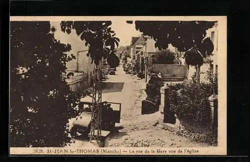AK St-Jean-le-Thomas, La rue de la Gare vue de l`eglise