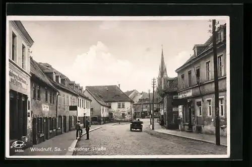 AK Wilsdruff /Sa., Dresdner Strasse mit Büchsenmacherei Otto Rost und Kirche