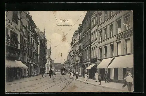 AK Trier, Simeonstrasse mit Geschäften und Strassenbahn
