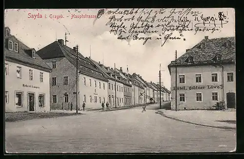 AK Sayda i. Erzgeb., Hauptstrasse mit Hotel goldner Löwe und Geschäft von Robert Langer