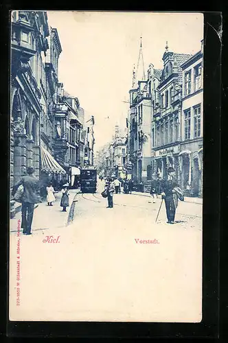 AK Kiel, Strassenpartie in der Vorstadt mit Geschäften und Strassenbahn