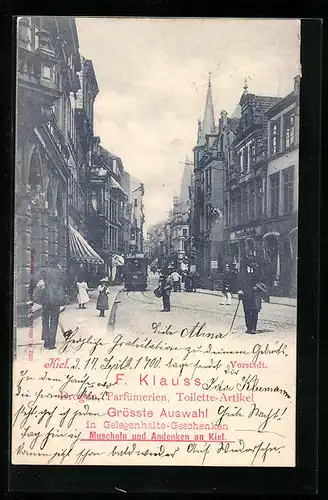 AK Kiel, Strassenpartie in der Vorstadt mit Geschäften und Strassenbahn