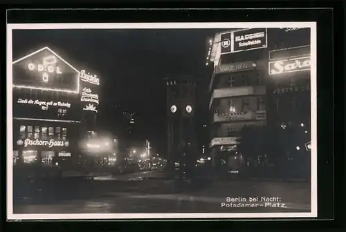 AK Berlin-Tiergarten, Reklame bei nacht auf dem Potsdamer Platz