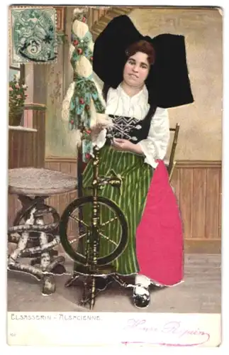 Stoff-Präge-AK Frau am Spinnrad in elsass-lothringischer Tracht aus Echtstoff