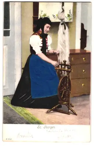 Stoff-Präge-AK St. Georgerin am Spinnrad in Tracht, Echtstoff