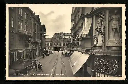 AK St. Pölten, Kremserstrasse mit Bahnhof und Geschäften