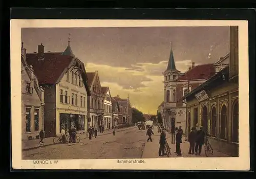 AK Bünde i. W., Bahnhofstrasse mit Kirche