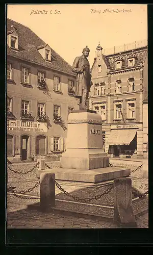 AK Pulsnitz i. Sa., Schneiderei von Emil Müller und König Albert-Denkmal