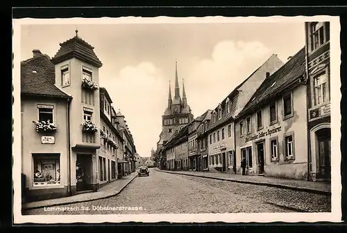 AK Lommatzsch i. Sa., Döbelnerstrasse mit Kirche