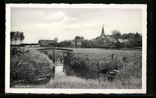 AK Nordwohlde, Ortsansicht mit Ufer und Kirche