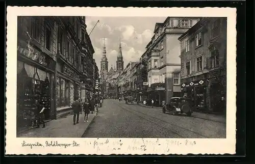 AK Liegnitz, Goldberger Strasse mit Geschäften und Kirche