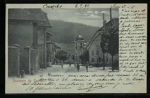 Mondschein-AK Couvet, Strassenpartie mit Kirche