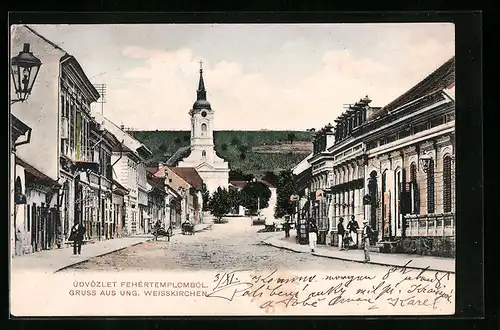 AK Ung. Weisskirchen, Strassenpartie mit Blick zur Kirche