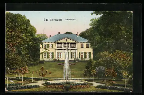 Goldfenster-AK Bad Nenndorf, Schlösschen mit Springbrunnen, mit leuchtenden Fenstern