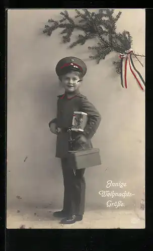 AK Weihnachtsgrüsse von einem lächelnden Jungen in Uniform