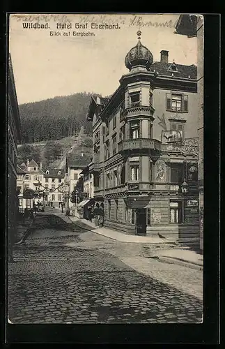 AK Wildbad, Strassenpartie am Hotel Graf Eberhard und Blick zur Bergbahn