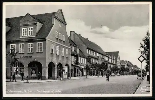 AK Ebenrode, Goldaperstrasse mit Gsechäften und Litfasssäule