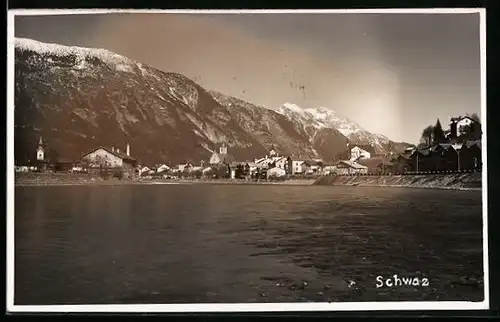 AK Schwaz, Ortsansicht mit Gewässer und Alpen