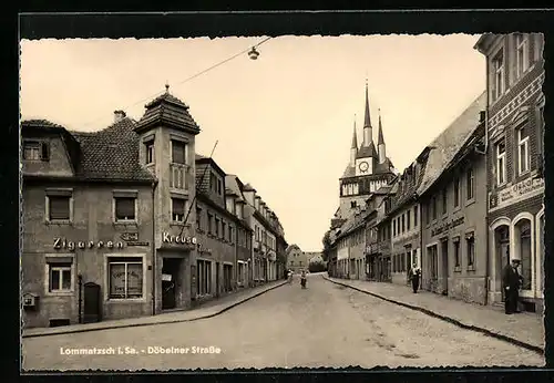 AK Lommatzsch i. Sa., Döbelner Strasse mit Geschäften